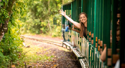 Traveller waving from departing train.